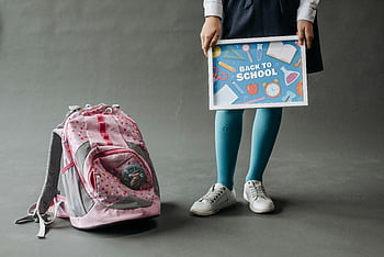 back to school, child, uniform, backpack, studio photo, poster, school sign, pink backpack, blue tights, white sneakers, education