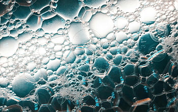 soap bubbles, close-up shot, macro photo, ethereal lighting, intricate patterns, bubble patterns, captivating image, detailed bubbles, macro bubbles, soap bubble art, bubble photography