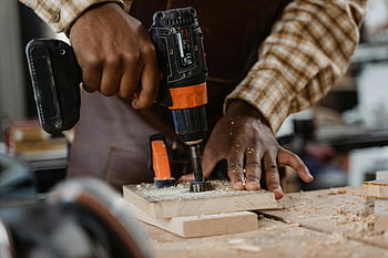 carpenter, impact driver, close-up shot, woodworking, precision, wooden board, craftsman, drill, skillfully, woodwork, tools