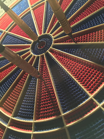 dartboard, bullseye, darts, competitive sports, round dartboard, black and red, detailed view, sports moment, target practice, dart game, precision game