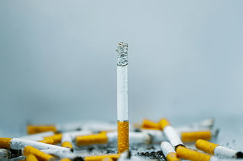 cigarettes, ash, close-up, cigarette butts, white surface, tobacco addiction, smoking, cigarette filters, cigarette ends, smoking cessation, health risks