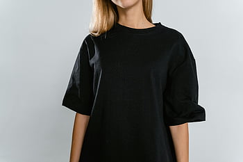 woman, black t-shirt, crew neck, front view, white background, copy space, casual wear, fashion, minimalist style, female model, black clothing