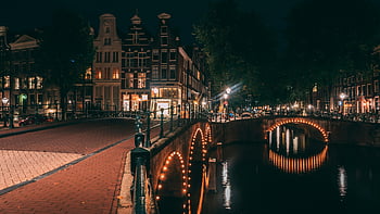 Amsterdam canal, illuminated bridges, urban charm, night view, canal view, city lights, Amsterdam nightlife, canal scene, urban scenery, night photography, cityscape photography