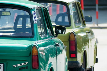 green Trabant cars, retro vehicles, classic cars, green cars, urban street, sunny day, close-up photo, vintage cars, Trabant 601, green classic vehicles, retro Trabant