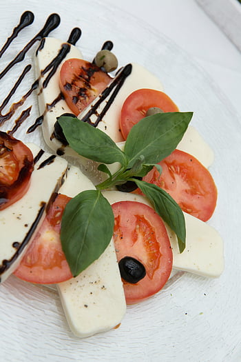 Caprese salad, sliced tomato, white ceramic plate, fresh tomatoes, mozzarella, basil, balsamic glaze, Italian cuisine, healthy food, vegetarian dish, appetizer
