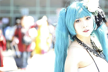 cosplay, Miku, blue hair, vibrant costume, outdoor setting, portrait, woman, intricate costume, bright setting, cosplay event, anime character