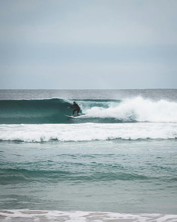 surfing, surfer, wavy sea, open ocean, daylight, adventure sport, riding waves, ocean waves, thrill of adventure, daytime surfing, unrecognizable surfer