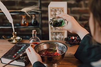 magic potion, potion making, mystical atmosphere, vibrant colors, magical, wizarding world, wooden table, spell book, glass bottle, red berries, candles