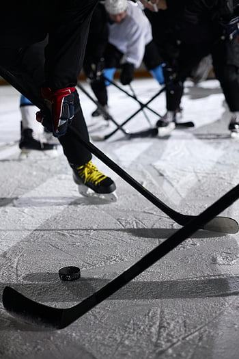 ice hockey, close-up photo, indoor rink, players in action, hockey game, ice rink, hockey sticks, hockey puck, sports action, winter sports, ice skating