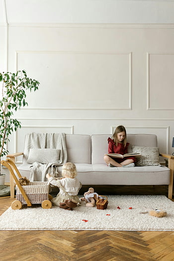 two girls, reading, playing, living room, cozy, couch, children, toys, indoor, home, family