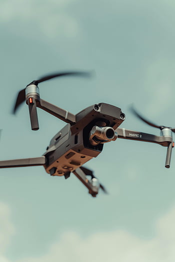 DJI Mavic 2, drone in flight, close-up view, sophisticated drone, clear blue sky, Colombia, aerial photography, unmanned aerial vehicle, quadcopter, flying drone, DJI technology