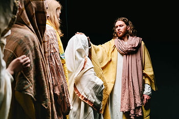 Jesus Christ, preaching, disciples, biblical reenactment, spirituality, faith, dramatic scene, followers, religious event, historical portrayal, spiritual gathering