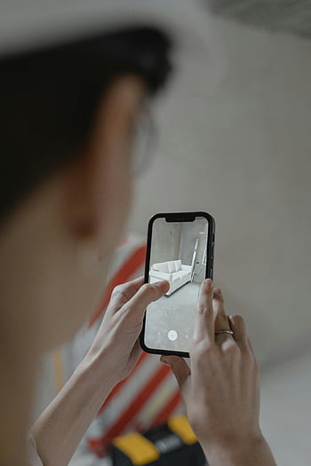 augmented reality, smartphone, furniture layout, person holding, iPhone, interior design, virtual furniture, home decor, mobile app, AR technology, digital design