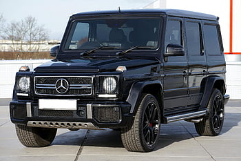 Black Mercedes G Class, Mercedes G-Class SUV, off-roading vehicle, urban driving, stylish black SUV, outdoor parking, luxury SUV, Mercedes-Benz G-Class, black SUV, G-Class exterior, G-Class design