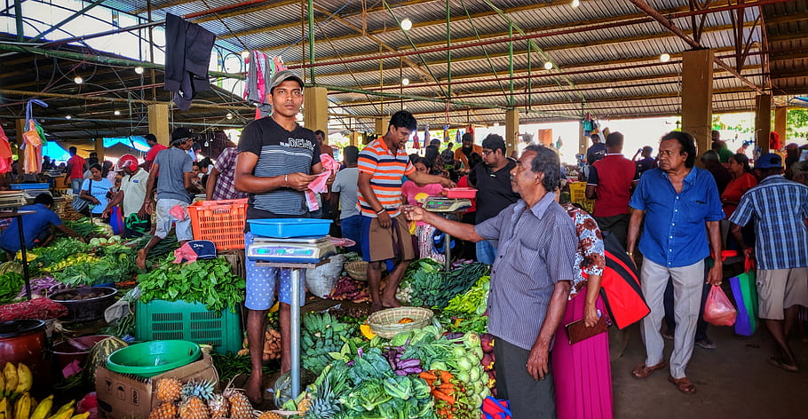 vegetable section, market, people, fresh produce, shopping, stall, scale, green vegetables, carrots, pineapple, bananas