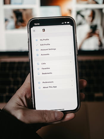 iPhone, settings menu, smartphone, blurred background, handheld device, account settings, my profile, edit profile, favorites, bookmarks, preferences