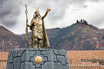 Plaza de Armas, Cusco, Peru, Inca statue, Andes mountain range, majestic statue, Cusco Peru, Inca culture, historical monument, travel destination, South America