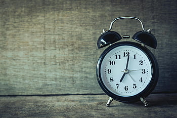 black analog alarm clock, 7:01, rustic wooden background, classic clock, time themes, nostalgia themes, vintage clock, analog clock, black clock, wooden surface, alarm clock
