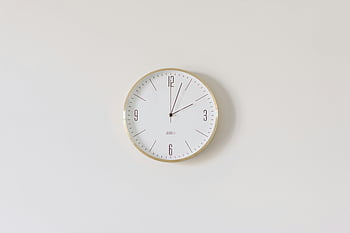 round analog wall clock, gold trim, white wall, minimalist clock, round wall clock, gold rim, white face, analog clock, wall clock, minimalist design, white background