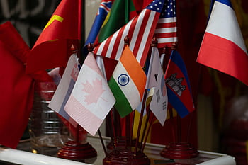 national flags, international diversity, colorful display, multiple flags, country flags, flag stands, global flags, world flags, international flags, flag collection, diverse flags