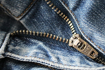 blue denim, zipper, close-up, metal zipper, denim texture, craftsmanship, detailed shot, blue jeans, fabric texture, denim bottoms, zipper detail