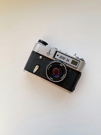 Retro fotoaparát, vinobraní film fotoaparát, klasický fotoaparát, bílý povrch, zachyceno shora, vinobraní fotoaparát, filmové kamery, bílý stůl, výše, klasické vinobraní
