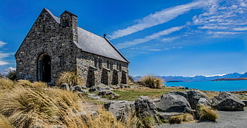 historic stone church, Lake Tekapo, bright blue sky, scenic New Zealand, landscapes, stone building, water view, mountain backdrop, outdoor scenery, historic architecture, natural beauty