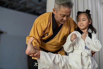 martial arts, instructor, young girl, karate uniform, indoor training, mature man, guiding, martial arts training, indoor martial arts, martial arts instructor, girl foot
