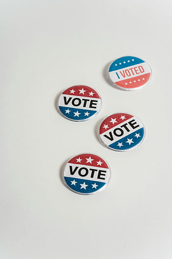 vote buttons, I Voted, pin-back buttons, red white blue, voting buttons, white surface, minimalistic backdrop, election pins, political buttons, campaign buttons, vote pins