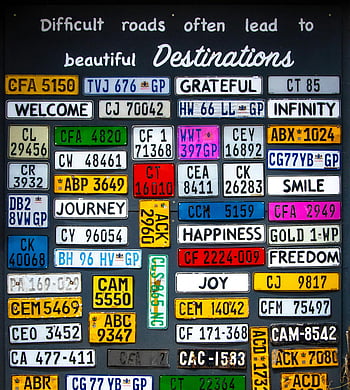 license plates, motivational phrases, vibrant background, diverse collection, difficult roads, beautiful destinations, journey, happiness, freedom, smile, joy