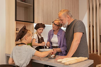 elderly couple, grandchildren, kitchen, cooking together, cozy kitchen, family bonding, grandparents, baking, multi-generation, home cooking, togetherness