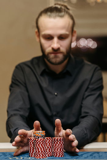 man-poker-chips-casino-table-gambling-risk-focused-handling-chips-indoor-game-strategy-thumbnail.jpg