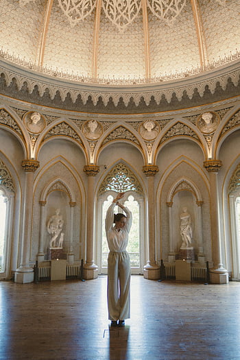 woman posing, Monserrate Palace, Sintra, ornate room, graceful woman, hands above head, interior architecture, historic palace, cultural landmark, European architecture, elegant pose