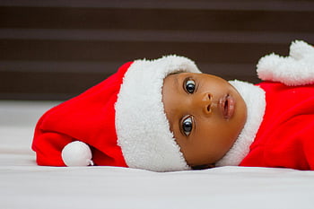baby, Santa hat, Christmas, cute baby, lying down, white cloth, festive, holiday, infant, red outfit, joy