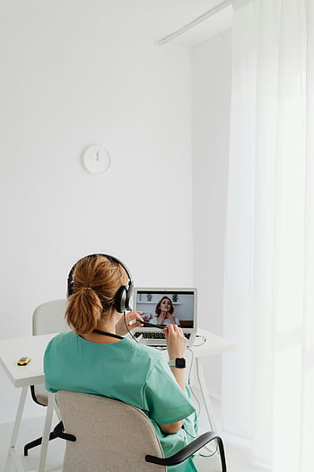 teleconsultation, healthcare professional, video call, patient, laptop, indoors, scrubs, telemedicine, remote consultation, medical consultation, online healthcare
