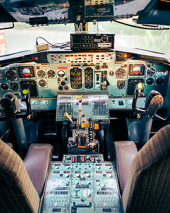 airplane cockpit, pilot cabin, control panels, instruments, close-up view, airplane interior, flight controls, aviation equipment, cockpit instruments, aircraft dashboard, pilot seat