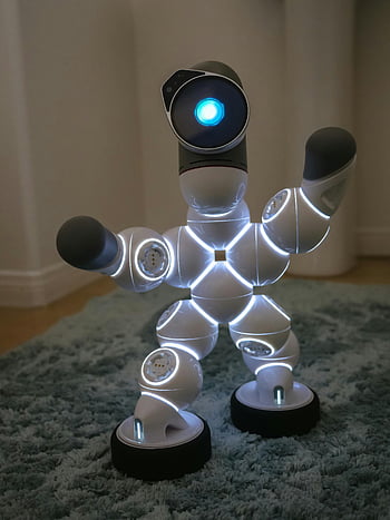 Clicbot, dancing robot, modern humanoid robot, glowing LED lights, indoor carpet, robot pose, futuristic robot, indoor robot, robot on carpet, LED robot, indoor scene