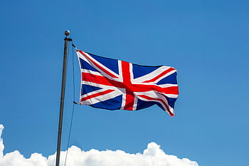 Union Jack, United Kingdom flag, British flag, clear blue sky, waving flag, UK flag, national flag, Union Jack flag, flagpole, blue sky, clouds