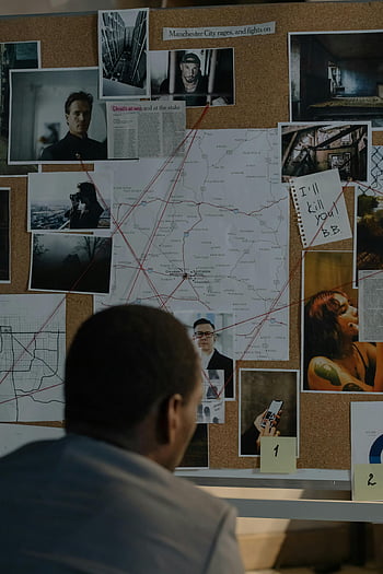 detective, crime investigation, suspect photos, notes, maps, gray shirt, man looking, investigation board, crime scene, police work, evidence analysis