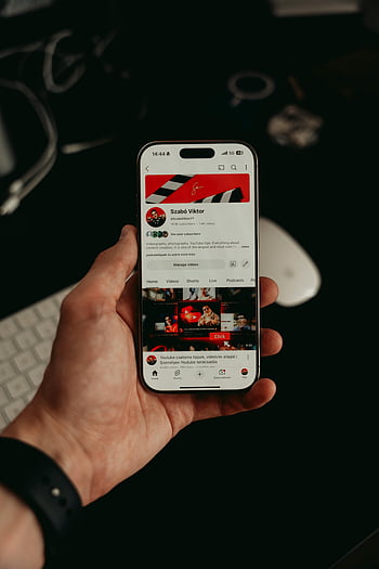 hand holding smartphone, mobile app interface, dark modern visuals, smartphone display, mobile app, modern smartphone, app interface, hand holding phone, smartphone screen, mobile application, dark visuals