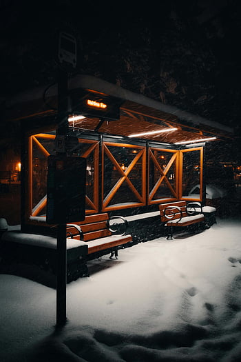 bus stop, snow, winter night, warm lights, empty bus stop, covered in snow, snowy scene, night scene, outdoor scene, winter landscape, snow-covered bus stop