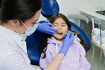 female dentist, young girl, dental clinic, teeth examination, modern clinic, dental care, tooth brushing, dental hygiene, dental chair, dental tools, patient care
