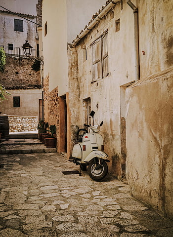 Old Vespa, cobblestone street, Palma Spain, vintage European charm, motor scooter, alley town, vintage scooter, European town, cobblestone alley, old scooter, vintage charm