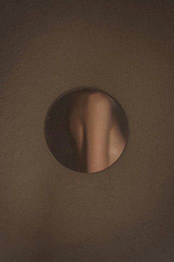 abstract art, circular hole, body part reflection, intimate visual, artistic photography, minimalistic design, creative composition, abstract composition, body art, artistic reflection, intimate art