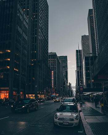 New York City, skyscrapers, busy street, urban life, cars on road, buildings, dusk, Radio City, cityscape, evening traffic, city streets