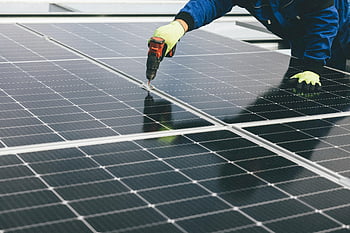 solar panel, power tool, technician, renewable energy, installation, gloves, sustainable energy, solar installation, energy efficiency, solar technology, eco-friendly