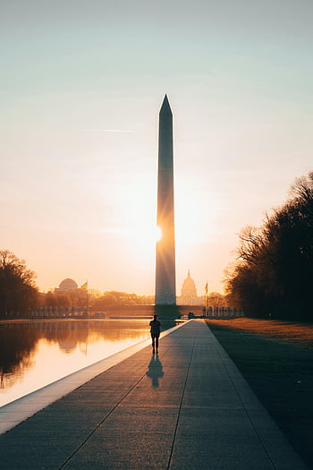 Washington Monument, Washington DC, sunrise, reflecting pool, person walking, obelisk, landmark, National Mall, travel destination, historic site, morning light