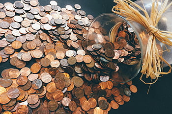 copper-colored coins, penny lot, spilled jar, savings pattern, finance representation, copper coins, penny savings, financial concept, coin collection, jar of pennies, savings finance