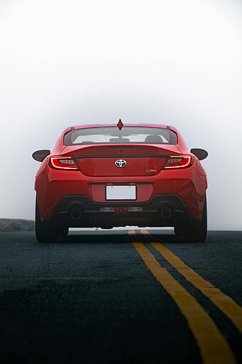Toyota GR86, rear view, red car, asphalt road, sporty design, modern aesthetics, open road, rear lights, car photography, automotive design, sports car