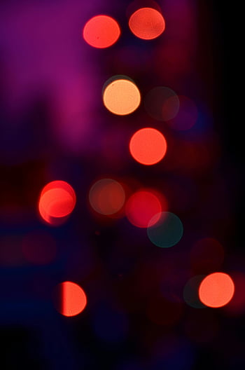 multi colored round lights, vibrant bokeh circles, red hues, pink hues, dreamy abstract visual, colorful bokeh, round light images, abstract background, bokeh effect, colorful circles, dreamy lights